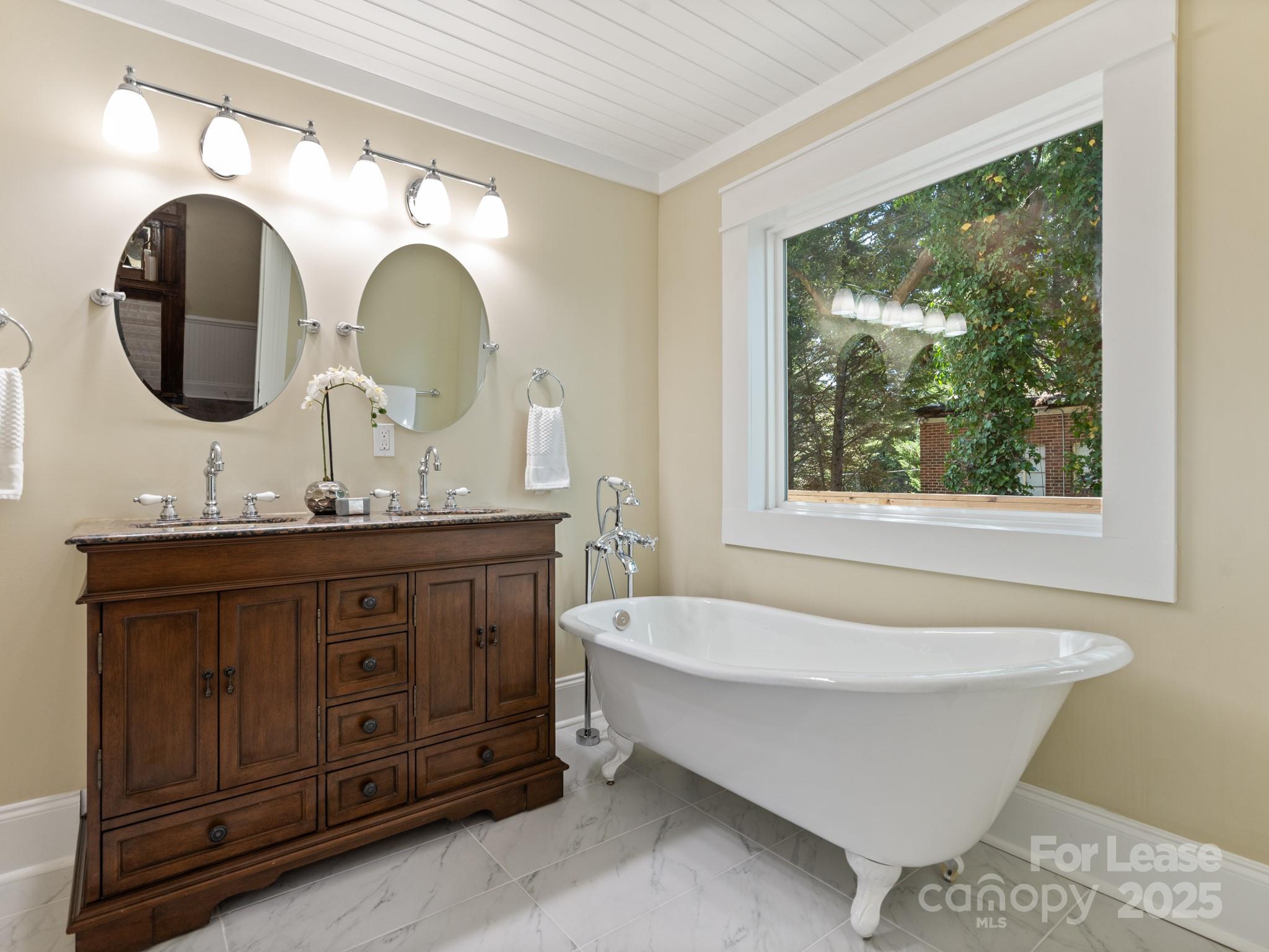 402 South Chester Street Gastonia, NC 28052 - Photo 15 of 48 a bathroom with a sink and a mirror
