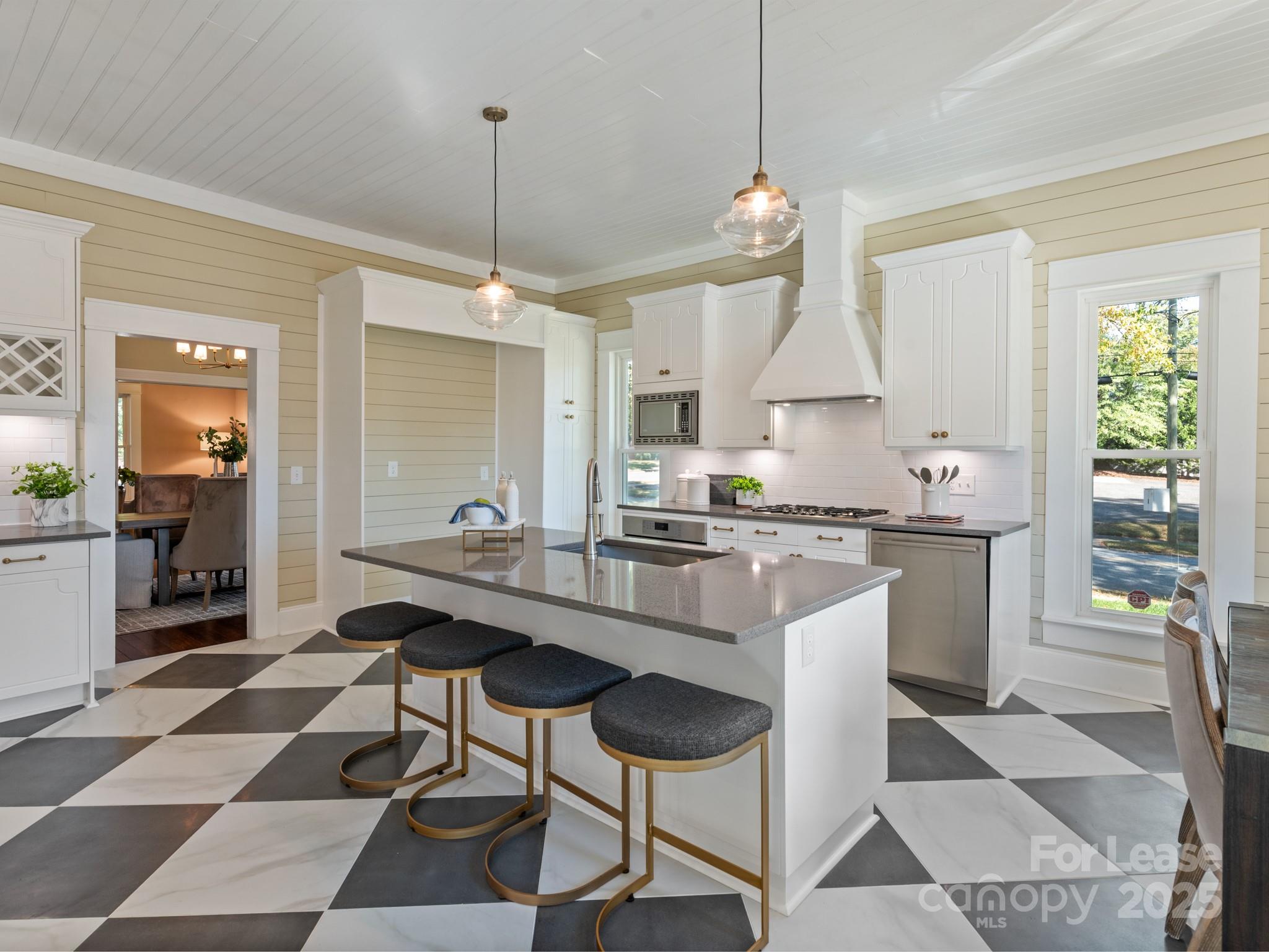 402 South Chester Street Gastonia, NC 28052 - Photo 22 of 48 a kitchen with stainless steel appliances granite countertop a sink a stove a refrigerator and cabinets