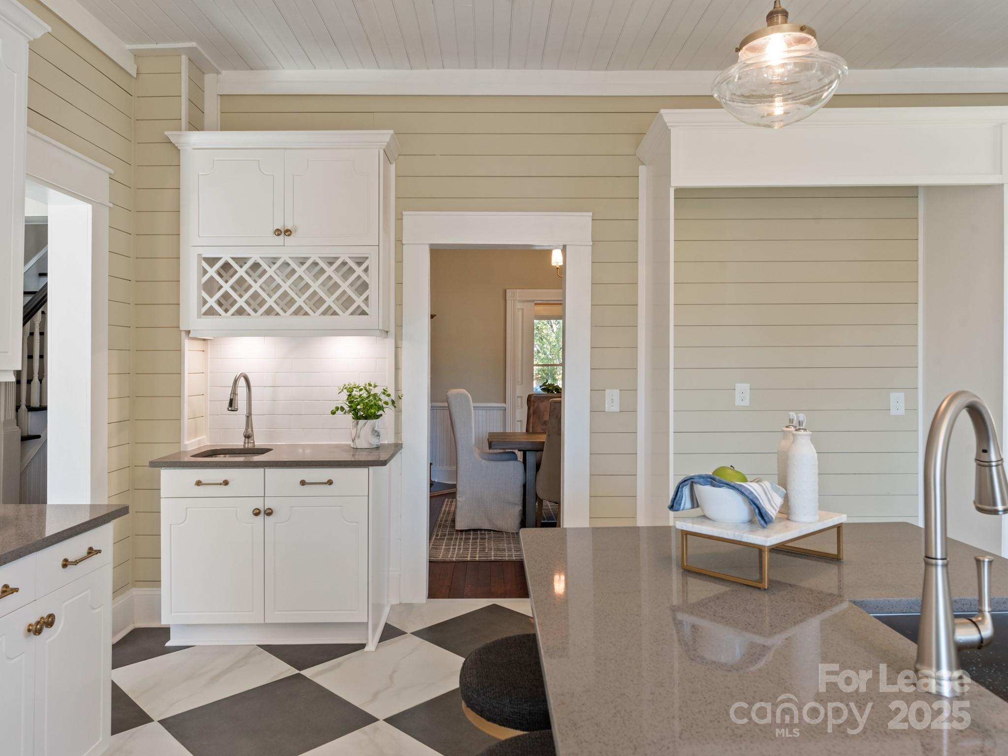 402 South Chester Street Gastonia, NC 28052 - Photo 23 of 48 a living room with furniture and a chandelier