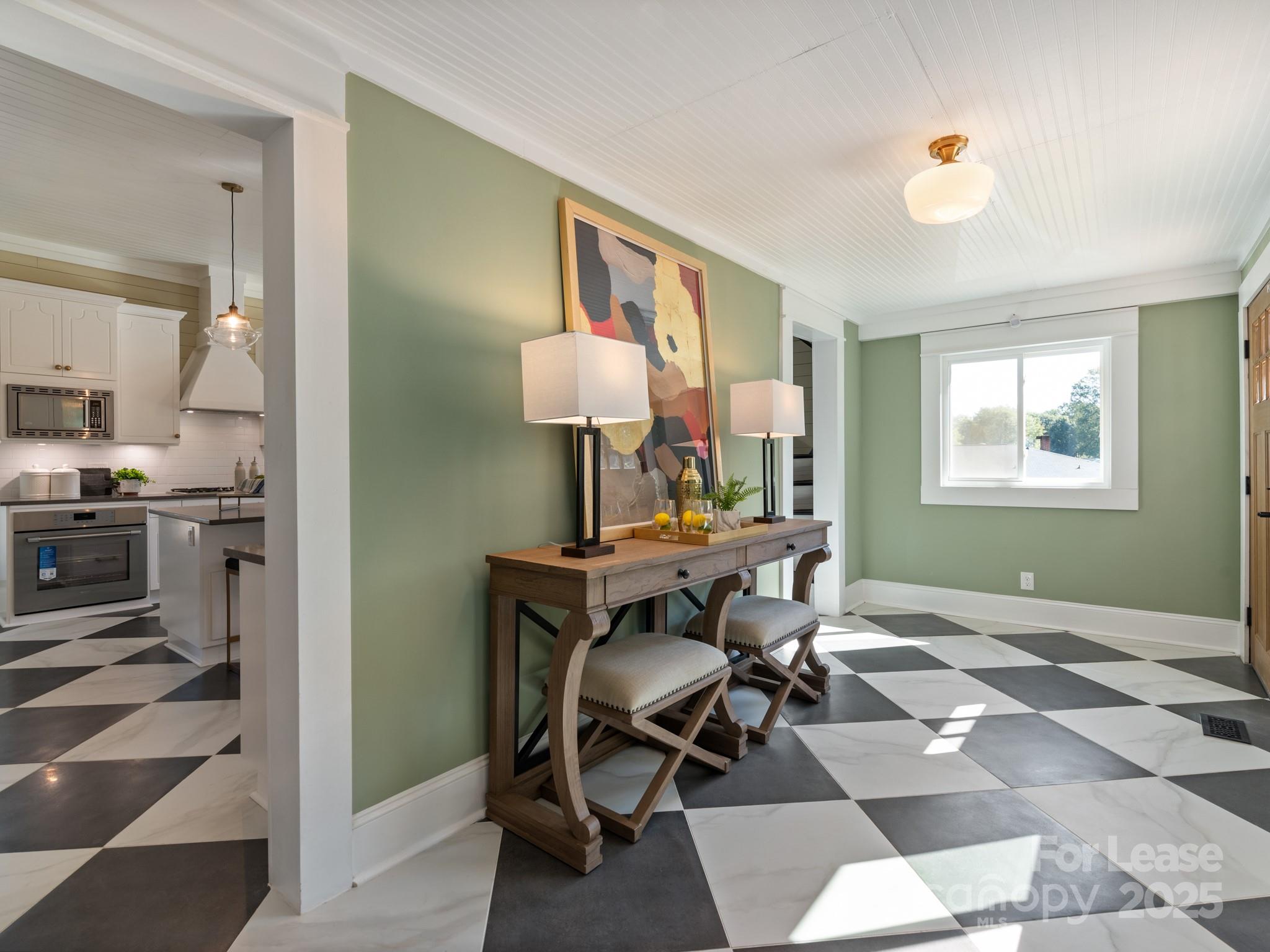 402 South Chester Street Gastonia, NC 28052 - Photo 26 of 48 a view of a workspace with furniture and a window
