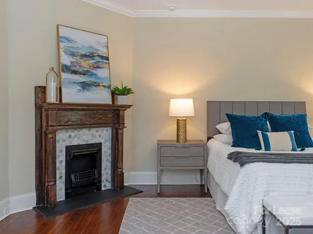 a bed room with a bed and a fireplace