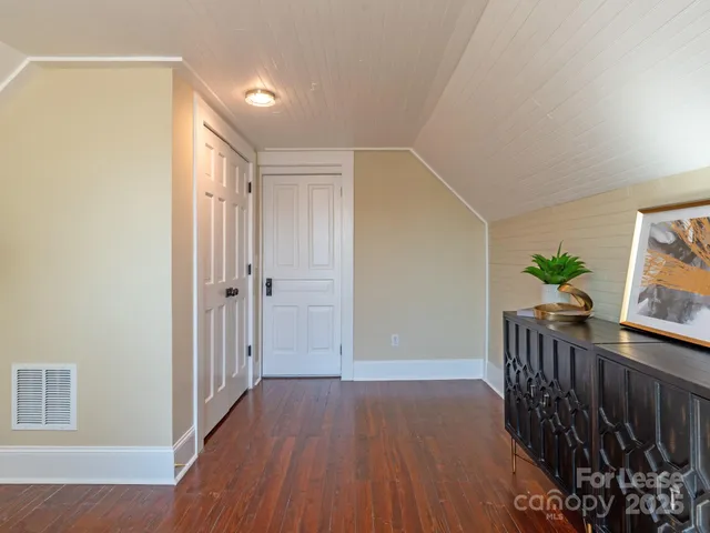a view of entryway with wooden floor
