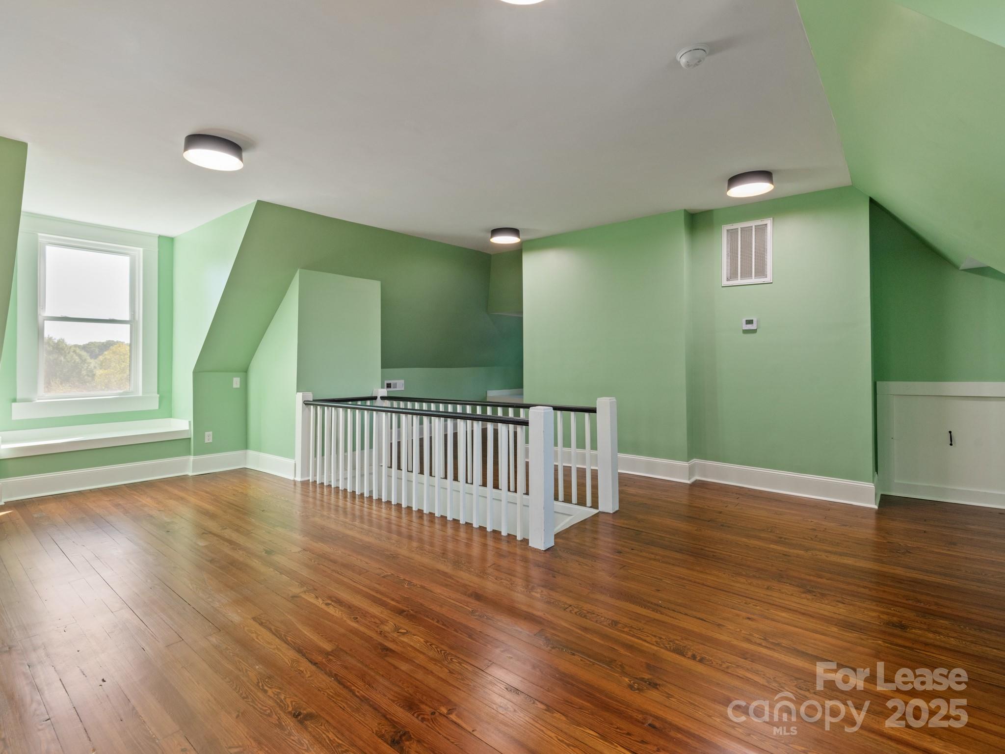 402 South Chester Street Gastonia, NC 28052 - Photo 44 of 48 a view of a hallway with wooden floor