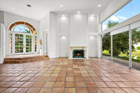 a kitchen with stainless steel appliances granite countertop a sink and a refrigerator