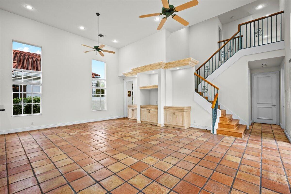 3241 Northwest 63rd Street Boca Raton, FL 33496 - Photo 31 of 75 a view of an entryway with wooden floor and a large window