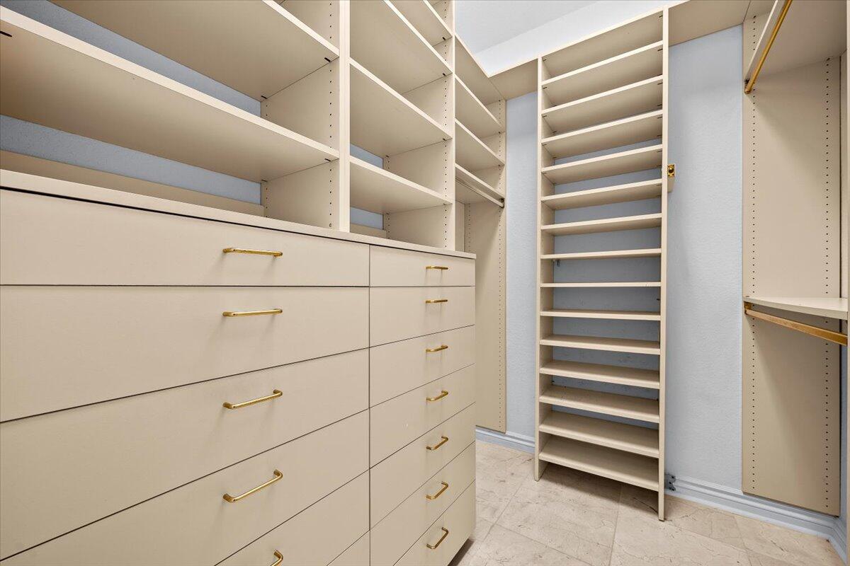 3241 Northwest 63rd Street Boca Raton, FL 33496 - Photo 36 of 75 a view of walk in closet with empty racks