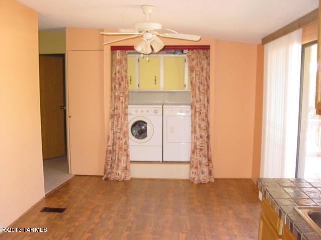 5201 North Lak A Yucca Road Tucson, AZ 85743 - Photo 17 of 19 a view of a bedroom with sliding door and wooden door