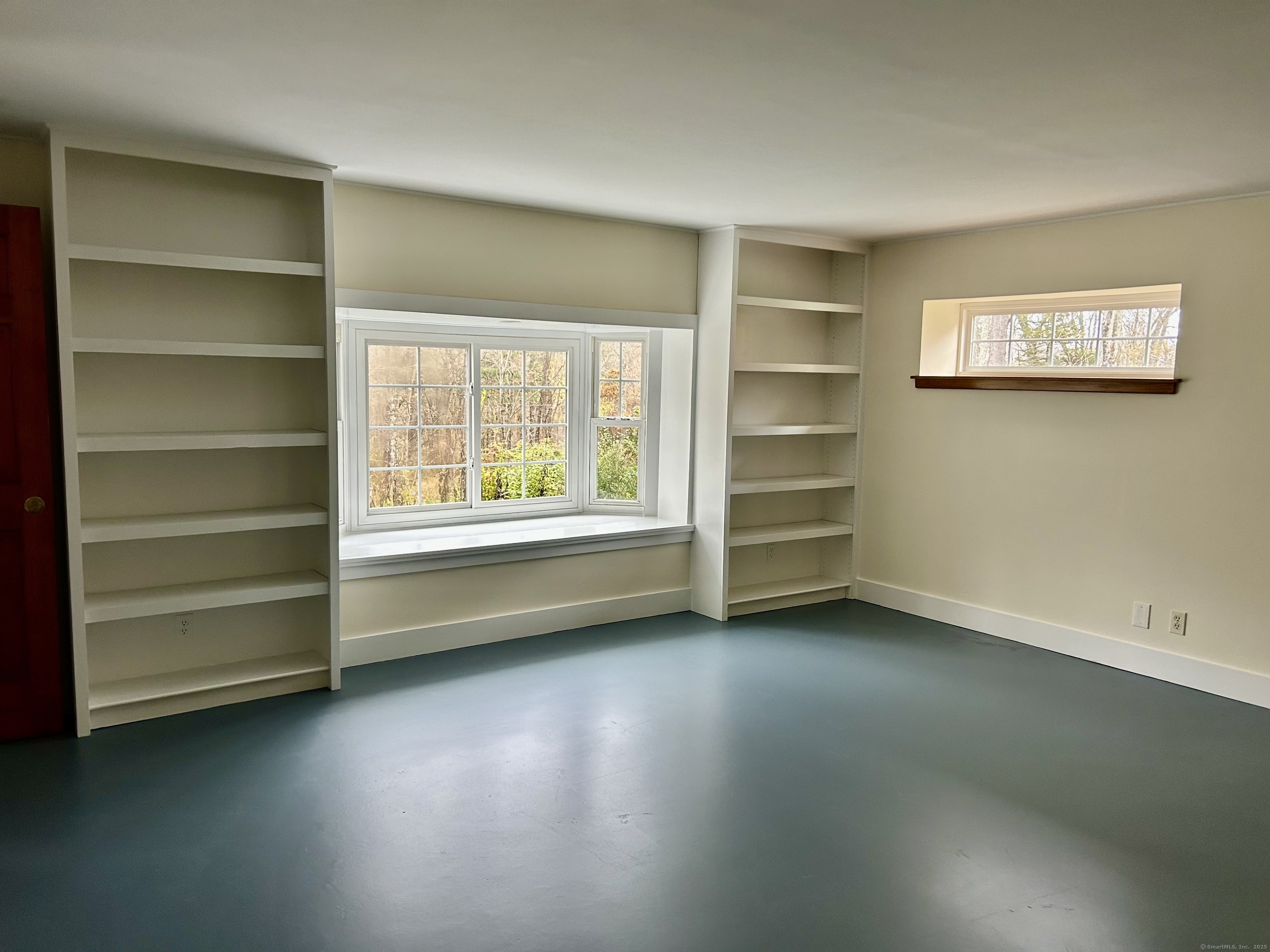 199 Hoop Pole Hill Road Woodbury, CT 06798 - Photo 10 of 15 a view of an empty room with a window