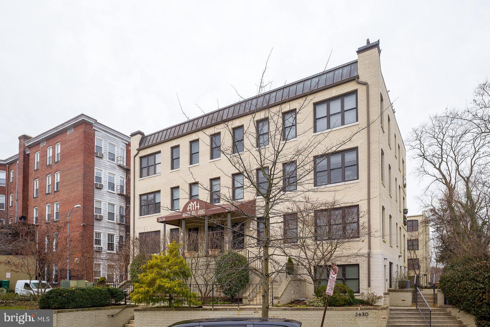 2630 Adams Mill Road Northwest, Unit 105 Washington, DC 20009 - Photo 3 of 13 a front view of a multi story building