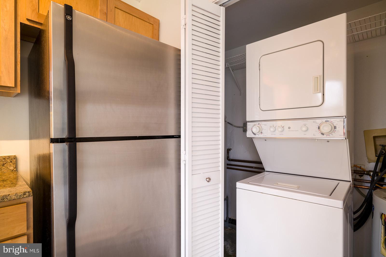 2630 Adams Mill Road Northwest, Unit 105 Washington, DC 20009 - Photo 9 of 13 a utility room with dryer and washer