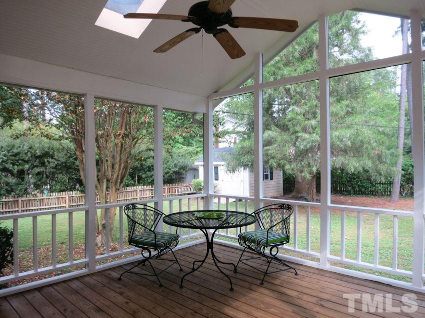 1013 Country Ridge Drive Raleigh, NC 27609 - Photo 21 of 25 a living room with furniture and a floor to ceiling window