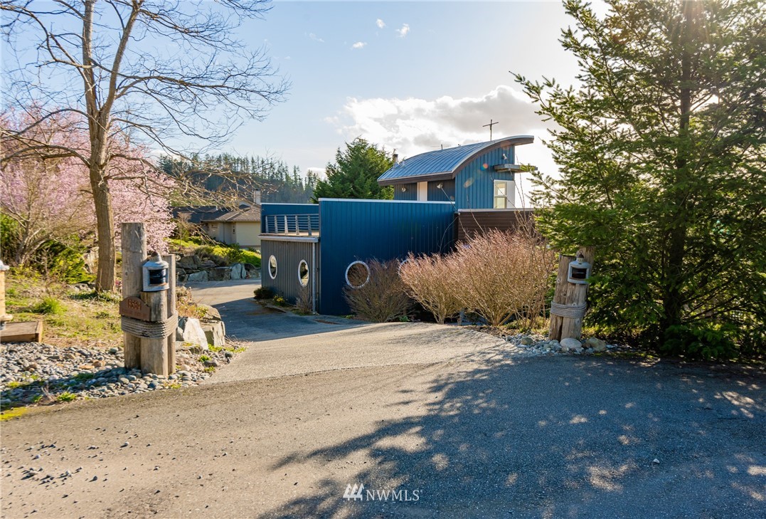 18564 Cascade View Drive Mount Vernon, WA 98274 - Photo 2 of 40 a side view of a house with a yard and garage