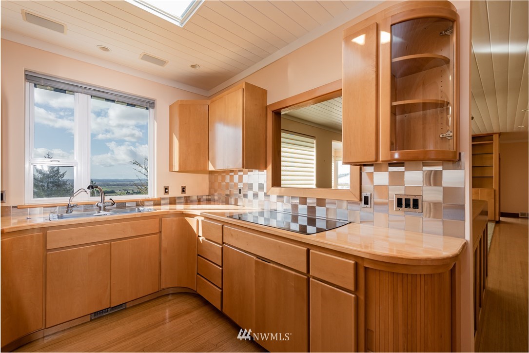 18564 Cascade View Drive Mount Vernon, WA 98274 - Photo 13 of 40 a kitchen with sink cabinets and wooden floor