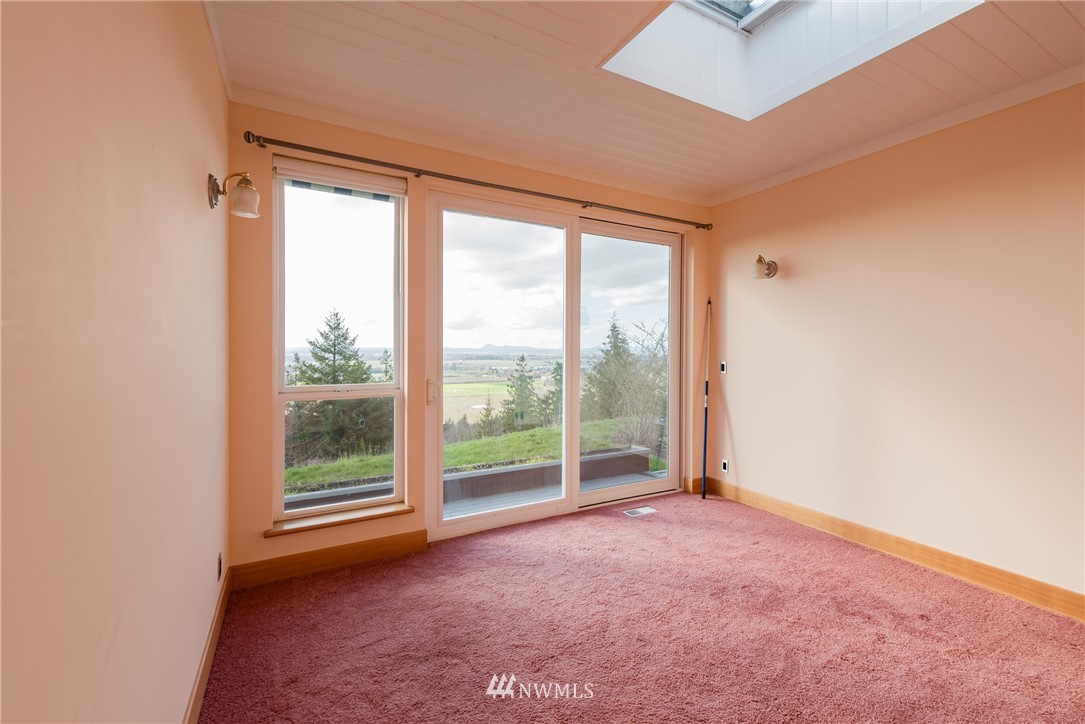 18564 Cascade View Drive Mount Vernon, WA 98274 - Photo 17 of 40 an empty room with large windows