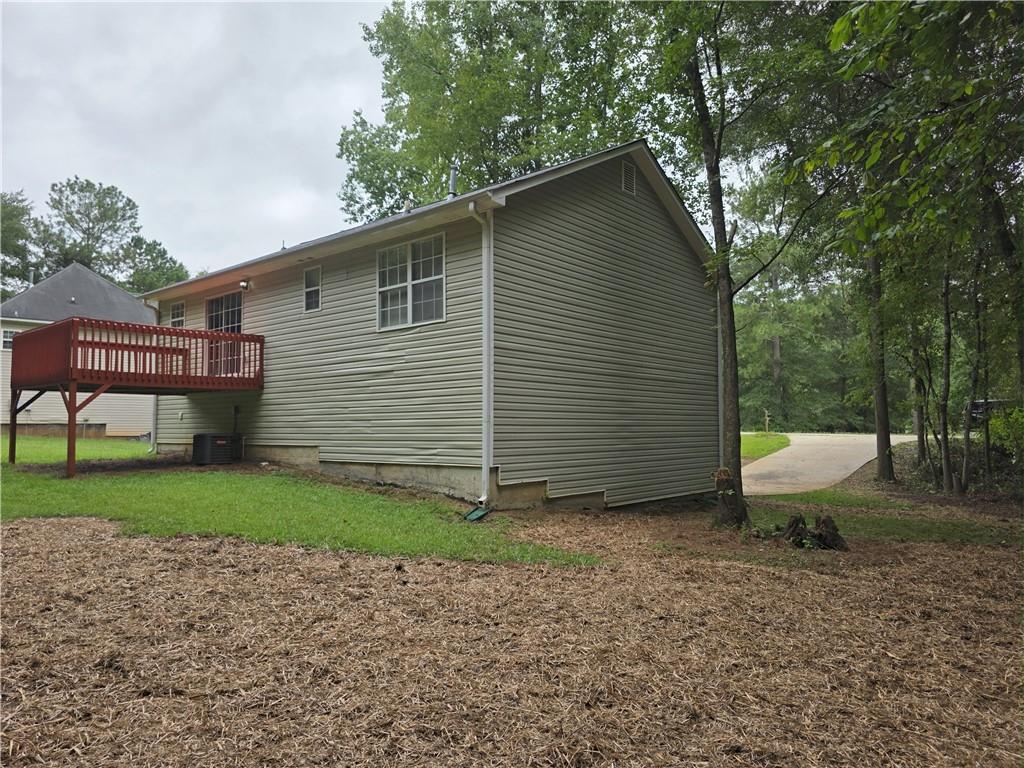 186 South Red Oak Way Temple, GA 30179 - Photo 19 of 19 a view of a backyard with plants and large tree
