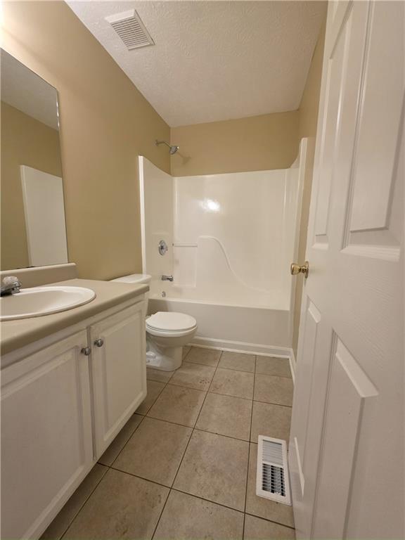 186 South Red Oak Way Temple, GA 30179 - Photo 10 of 19 a bathroom with a sink a toilet and a mirror