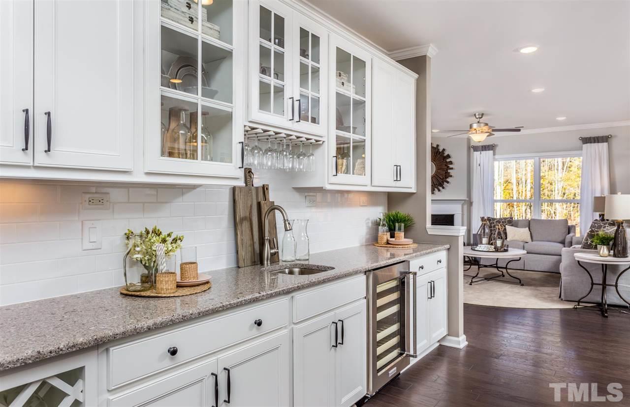 704 Haven Peak Lane Wake Forest, NC 27587 - Photo 14 of 28 a kitchen with stainless steel appliances granite countertop a white cabinets a sink and dishwasher