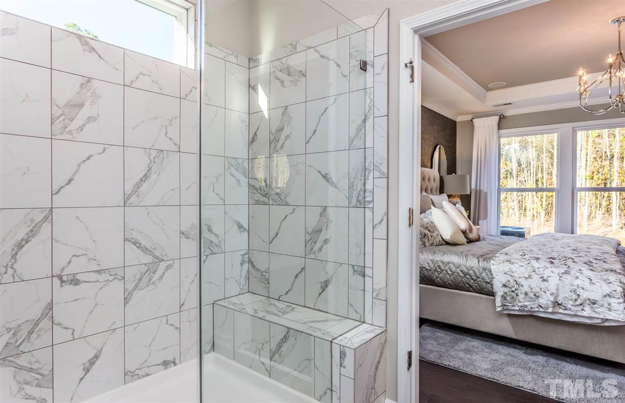 704 Haven Peak Lane Wake Forest, NC 27587 - Photo 18 of 28 a bedroom with a bed and a window