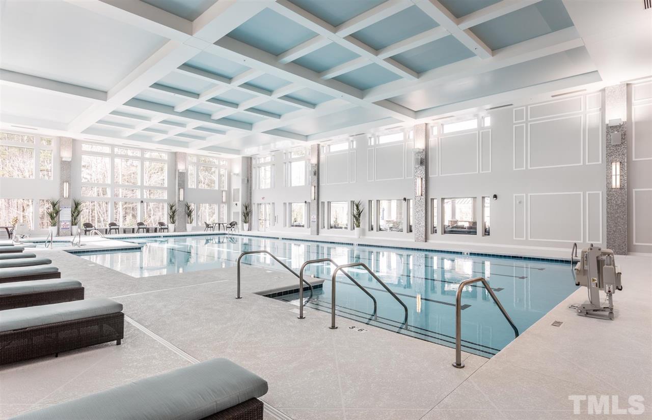 704 Haven Peak Lane Wake Forest, NC 27587 - Photo 25 of 28 a living room with furniture and a table