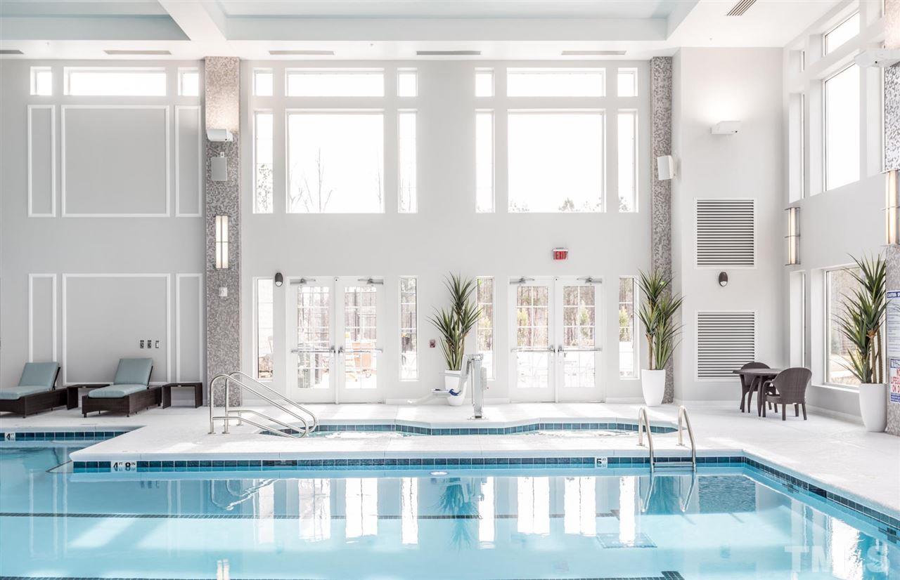 704 Haven Peak Lane Wake Forest, NC 27587 - Photo 26 of 28 a view of living room with a large window and chandelier