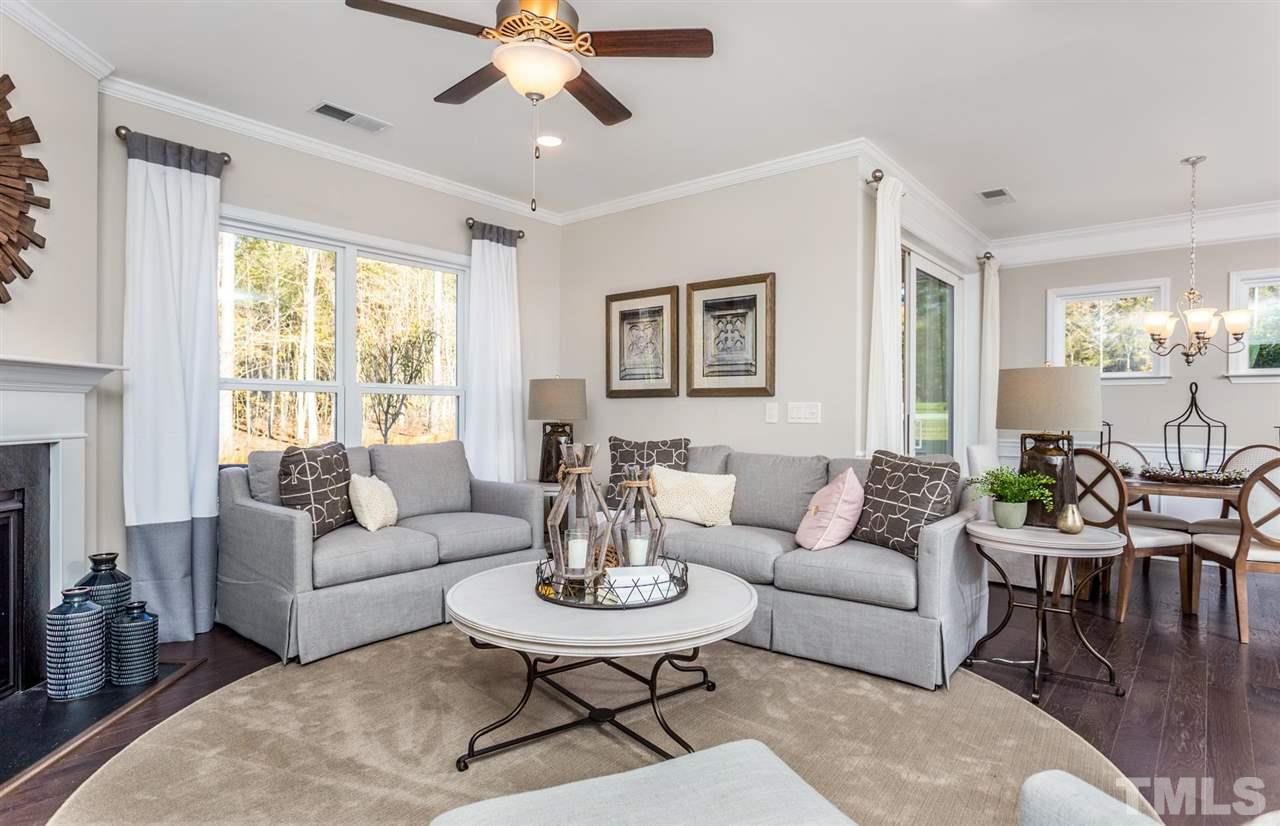 704 Haven Peak Lane Wake Forest, NC 27587 - Photo 5 of 28 a living room with furniture and a large window