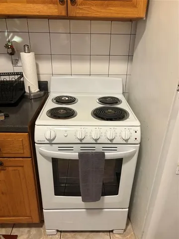 a bedroom with a bed and dresser