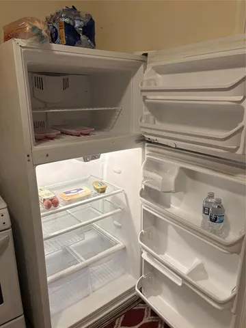 a kitchen with a stove and a refrigerator