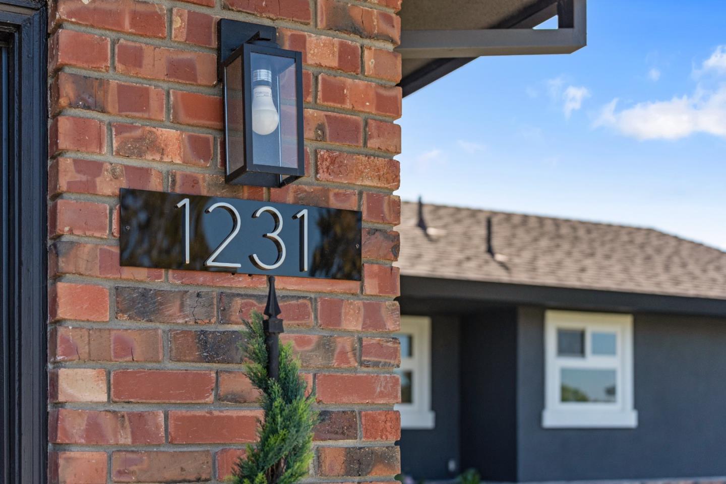 1231 Westward Drive Hollister, CA 95023 - Photo 2 of 68 a street sign on a brick building