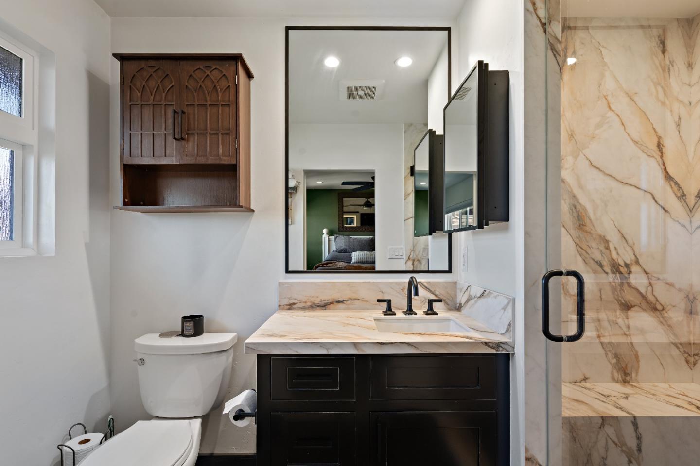 1231 Westward Drive Hollister, CA 95023 - Photo 35 of 68 a bathroom with a sink a toilet and a mirror