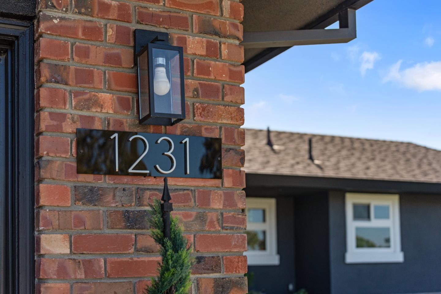 1231 Westward Drive Hollister, CA 95023 - Photo 57 of 68 a brick building with a sign on it
