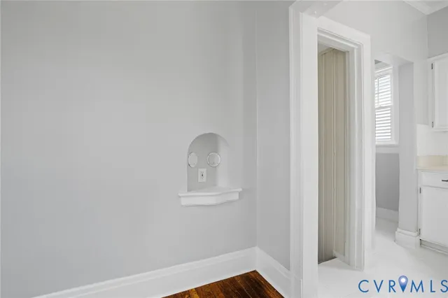 a kitchen with stainless steel appliances a stove a sink a microwave and a refrigerator