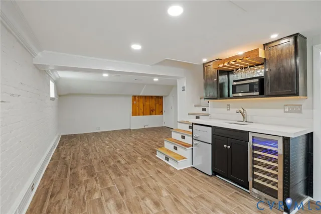 a view of a kitchen with furniture and natural light