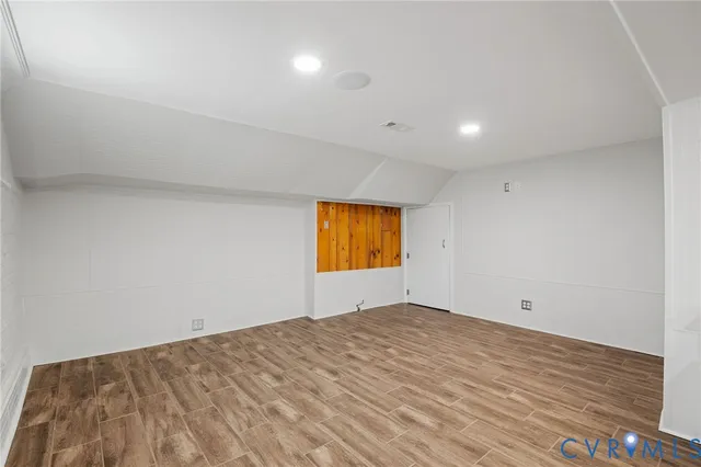 a kitchen with stainless steel appliances granite countertop a sink and a refrigerator