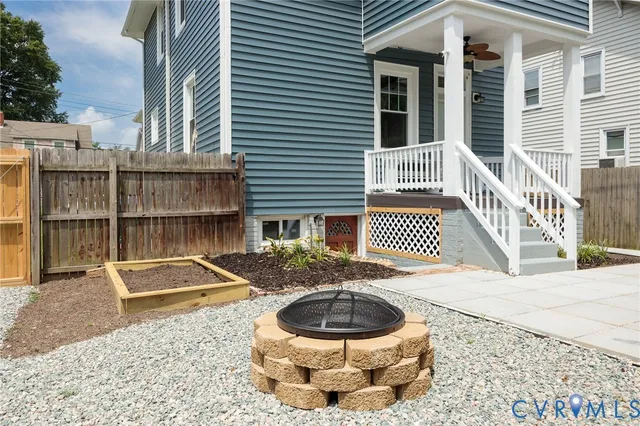 a view of a backyard with large trees