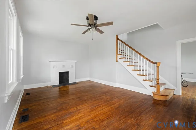 a view of an entryway with wooden floor