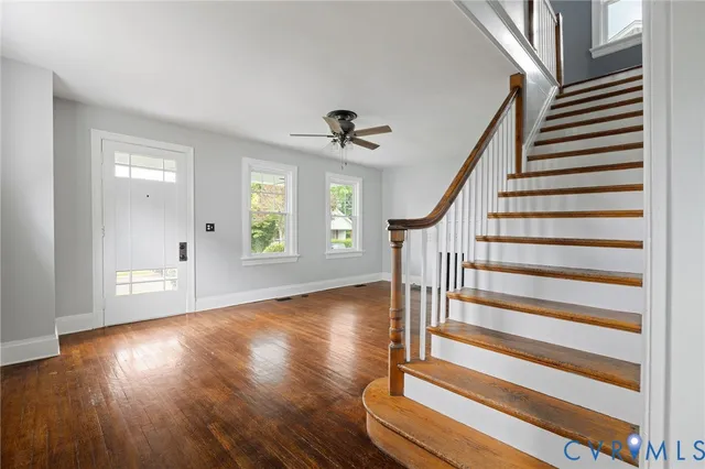 a view of kitchen and dining room with wooden floor