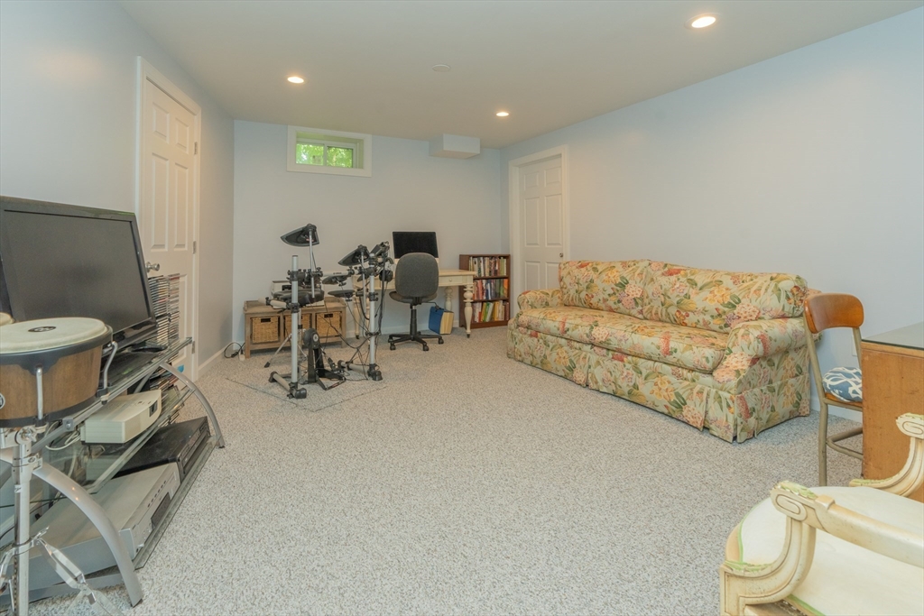 247 Cabinet Street Springfield, MA 01129 - Photo 31 of 40 a living room with furniture a white couch and a mirror