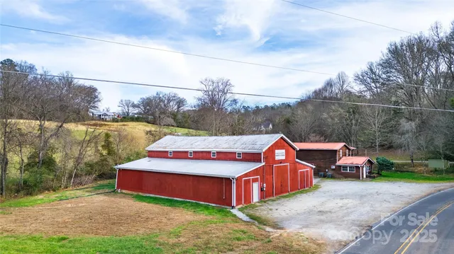 a aerial view of a house with big yard