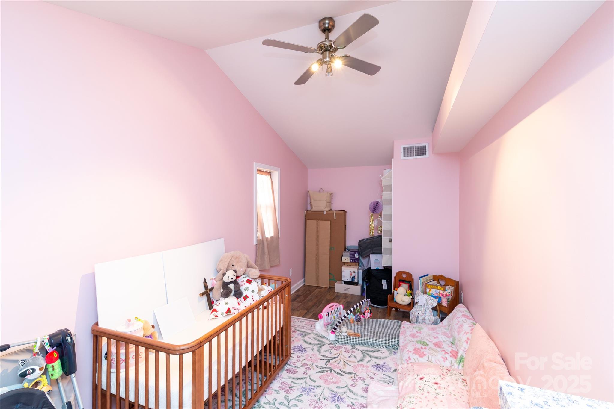 1137 Saunders Road Franklin, NC 28734 - Photo 15 of 30 a bedroom with furniture and a chandelier