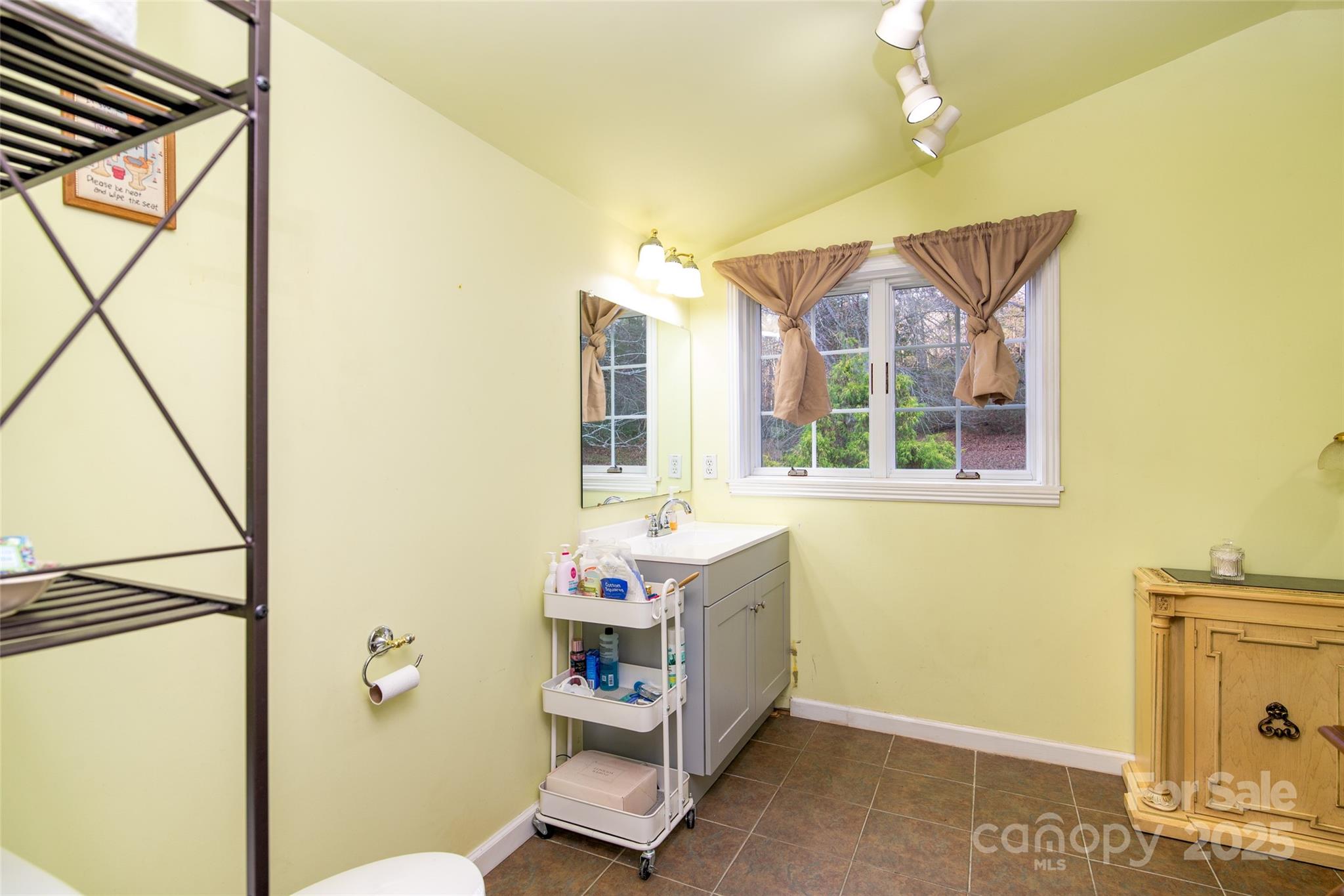 1137 Saunders Road Franklin, NC 28734 - Photo 16 of 30 a bathroom with a tub sink and mirror