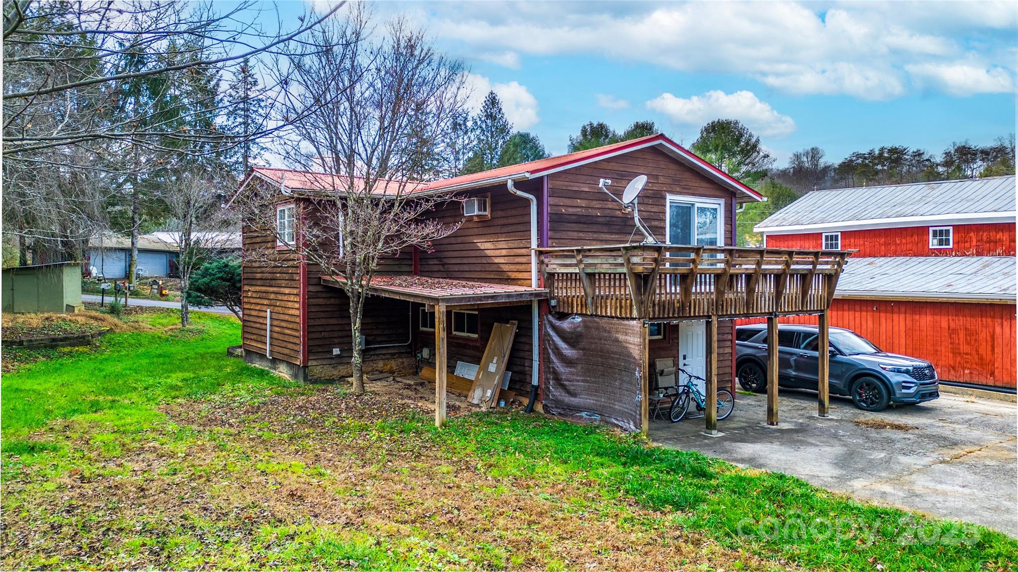 1137 Saunders Road Franklin, NC 28734 - Photo 20 of 30 a front view of a house with garden