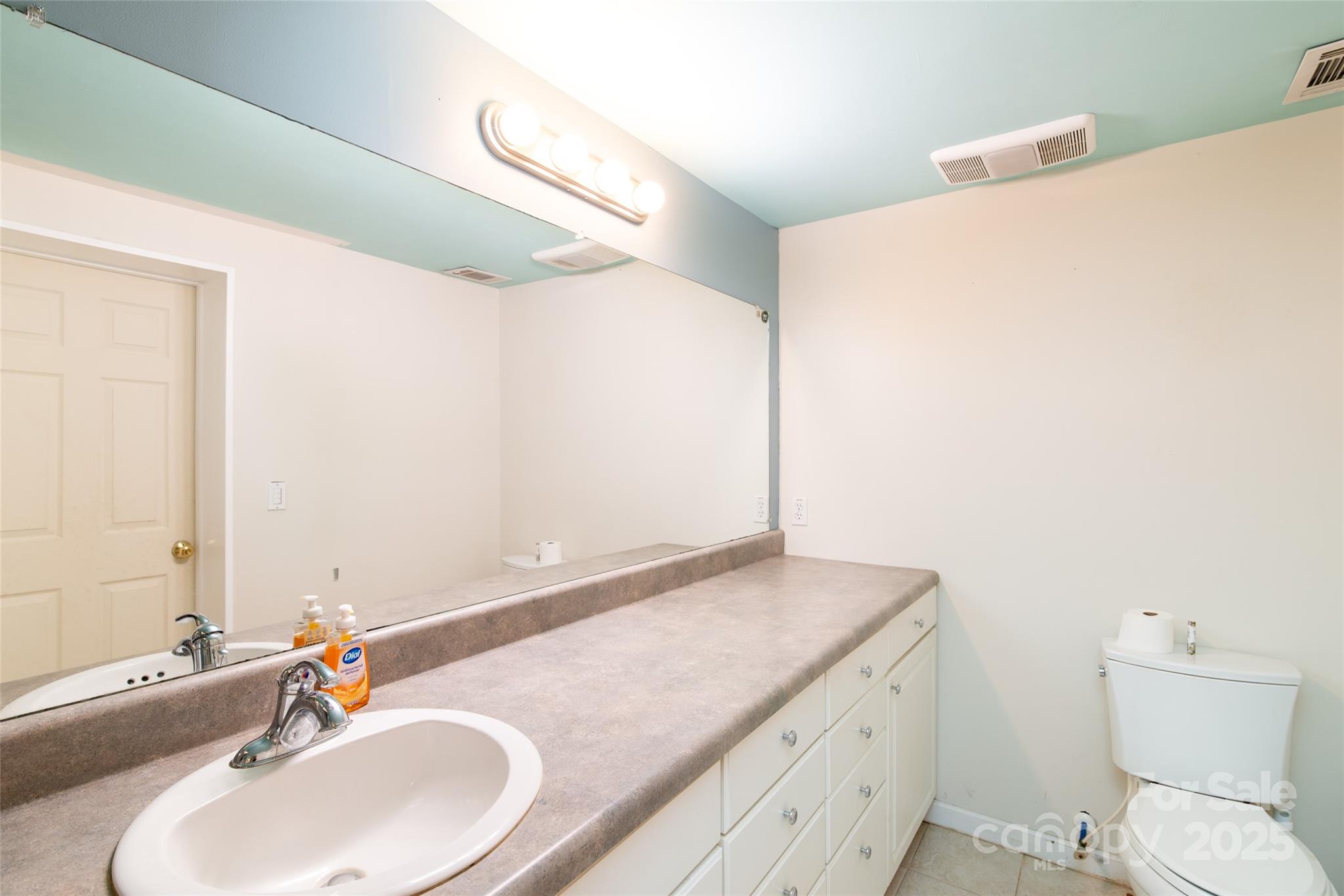 1137 Saunders Road Franklin, NC 28734 - Photo 10 of 30 a bathroom with a granite countertop sink and a mirror