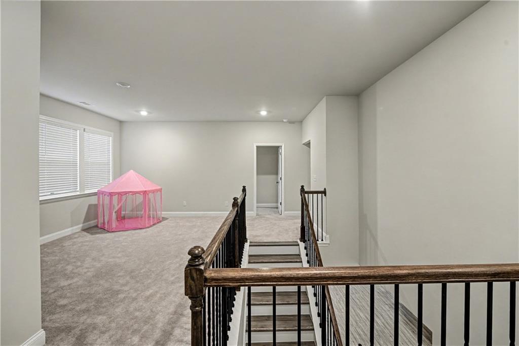 3068 Shirecrest Lane Dacula, GA 30019 - Photo 13 of 41 a bedroom with furniture and a window
