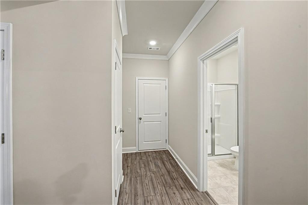 3068 Shirecrest Lane Dacula, GA 30019 - Photo 17 of 41 a view of a hallway with wooden floor