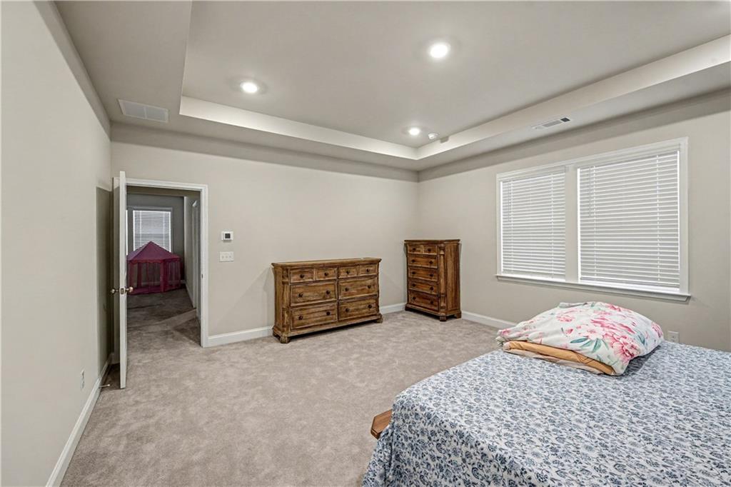 3068 Shirecrest Lane Dacula, GA 30019 - Photo 21 of 41 a bedroom with a bed and a cabinets