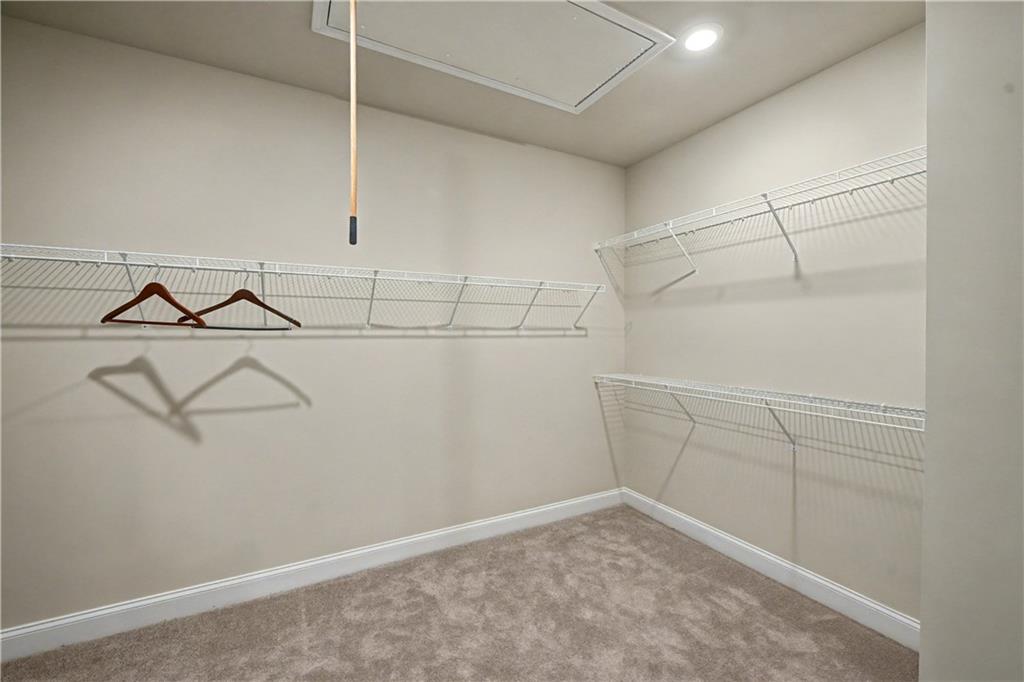 3068 Shirecrest Lane Dacula, GA 30019 - Photo 22 of 41 a view of a room with racks on the wall