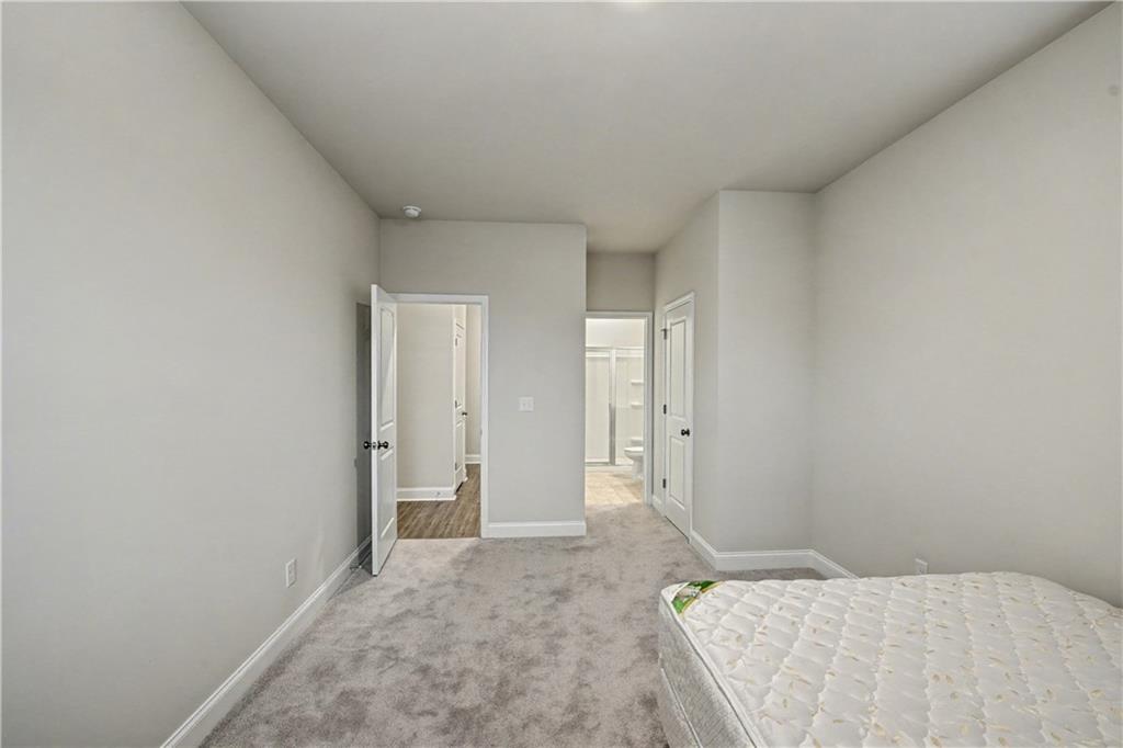 3068 Shirecrest Lane Dacula, GA 30019 - Photo 23 of 41 a bedroom with a bed and a shower
