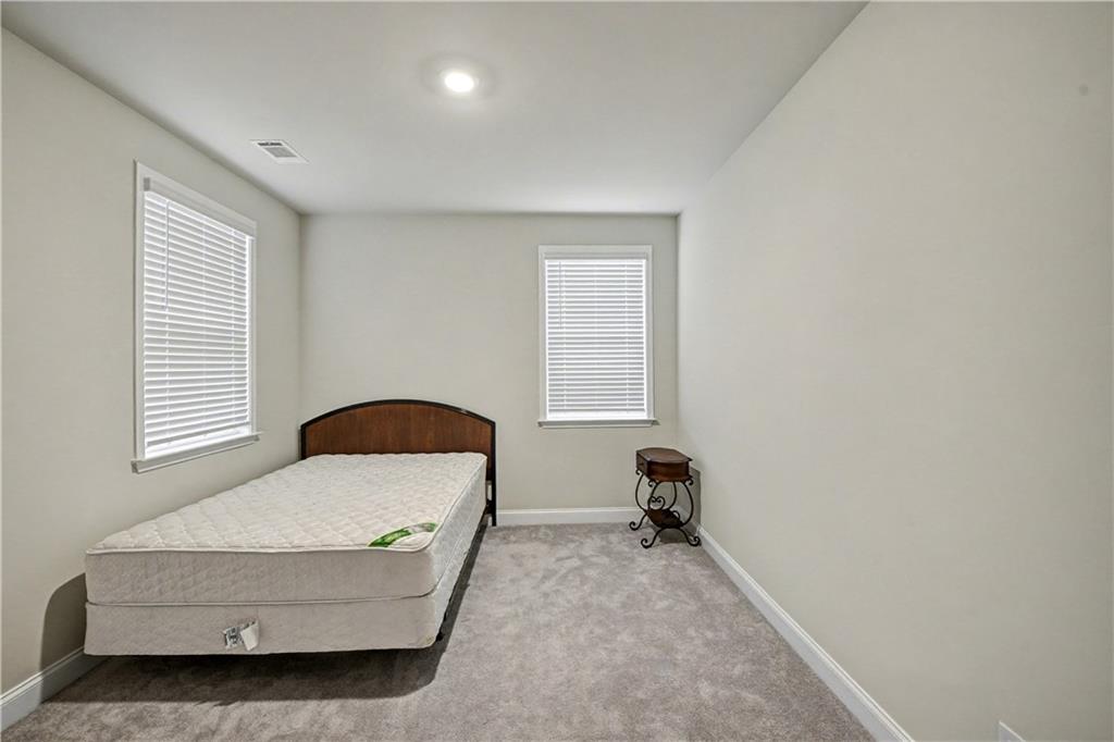 3068 Shirecrest Lane Dacula, GA 30019 - Photo 24 of 41 a living room with furniture and a window