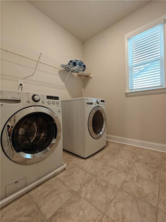 3068 Shirecrest Lane Dacula, GA 30019 - Photo 27 of 41 a utility room with dryer and washer