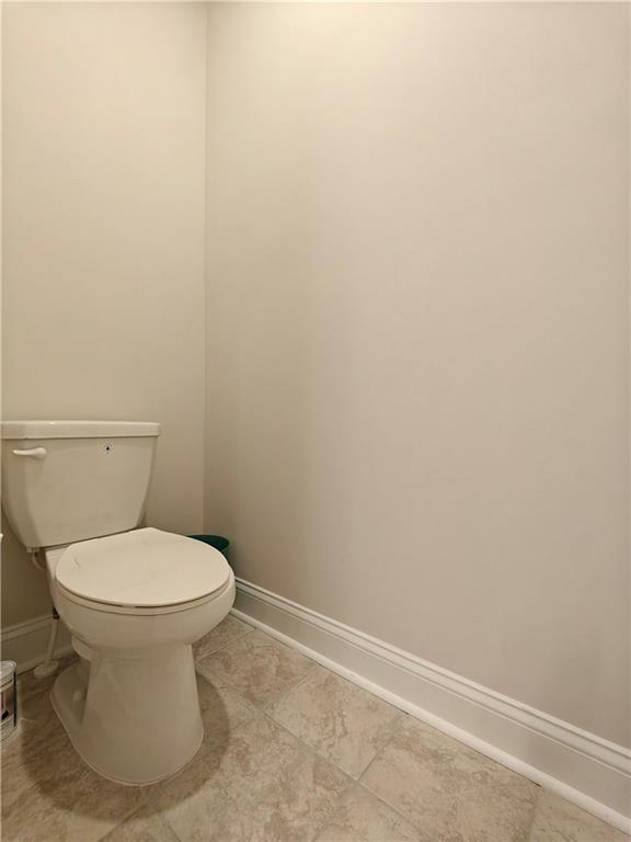 3068 Shirecrest Lane Dacula, GA 30019 - Photo 29 of 41 a white toilet sitting next to a white sink